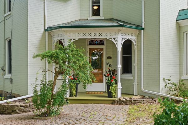 Victorian front porch with white gingerbread trim