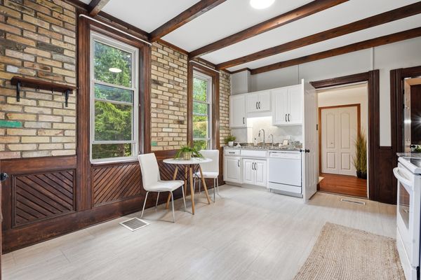 Kitchen breakfast nook with exposed heritage brick wall